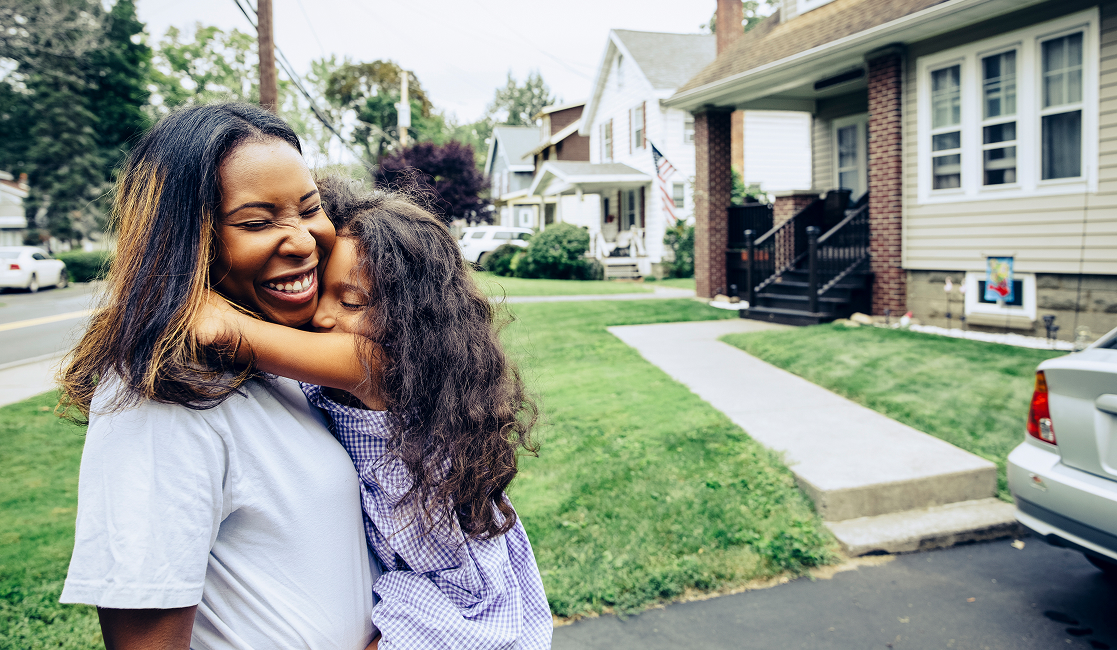Mother and daughter hug. 