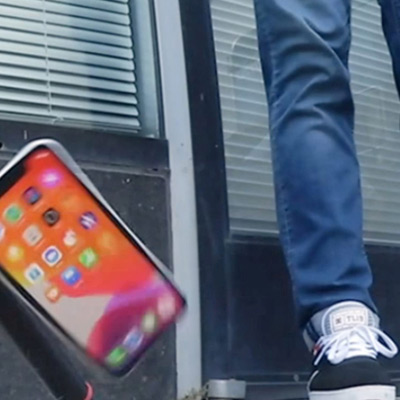 A breakability bot tests the durability of an iPhone. 