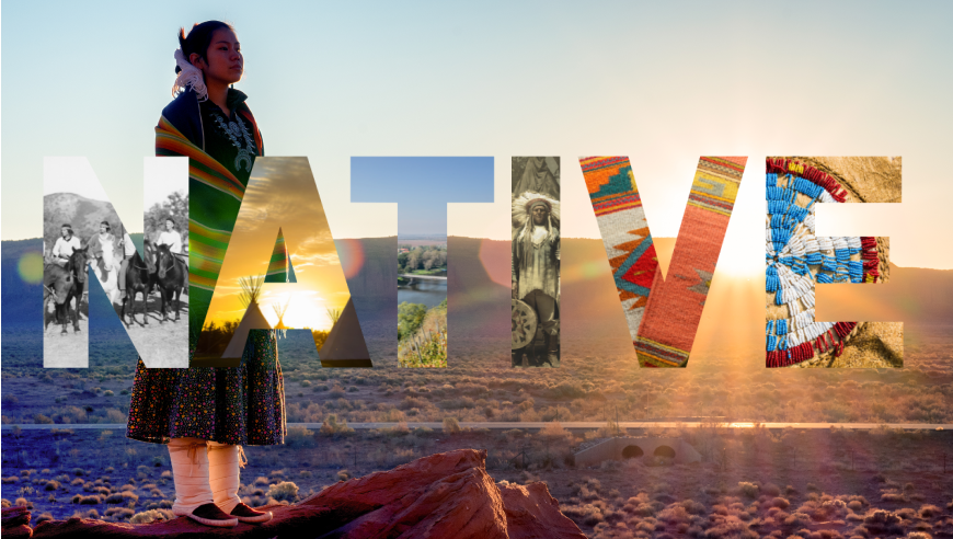 Native American person in ceremonial dress in the desert. 